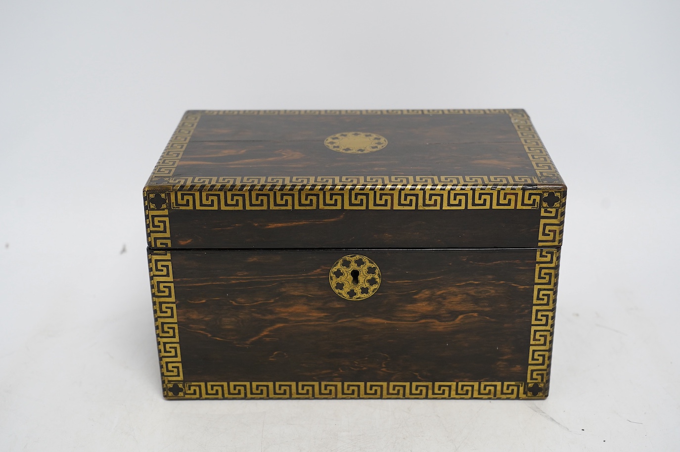 An early 19th century brass inlaid coromandel tea caddy with birch lining, 25cm wide. Condition - fair